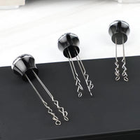 Detalle del agitador de café espresso de acero inoxidable, fabricado con material de grado alimenticio para una mayor durabilidad y seguridad.